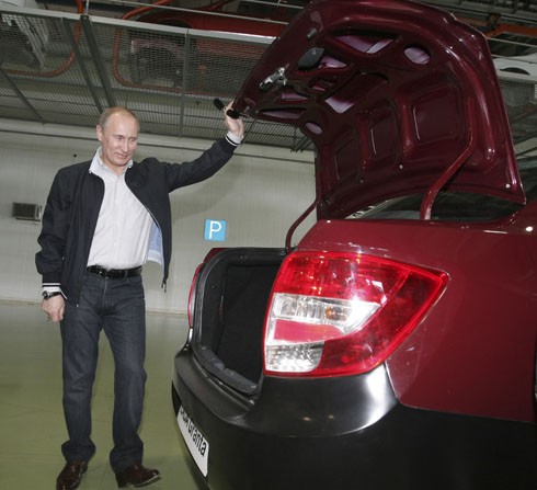 Russian Pime Minister Putin inspects a new Lada Granta during his visit to the AvtoVaz car plant in the southern Russian city of Tolyatti