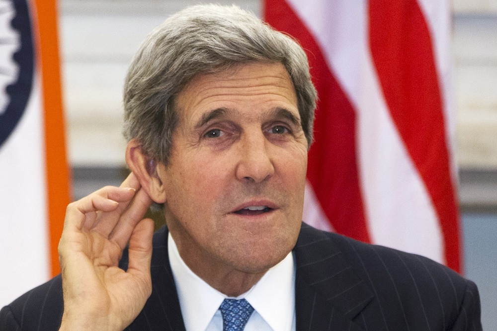 U.S. Secretary of State Kerry gestures as he asks reporter to repeat question during news conference with Indian Foreign Minister Khurshid at Hyderabad House in New Delhi