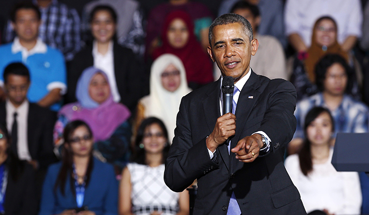 U.S. President Barack Obama points to the audience at the Young Southeast Asian Leadership Initiative (YSEALI) Town Hall inside the University of Malaya in Kuala Lumpur