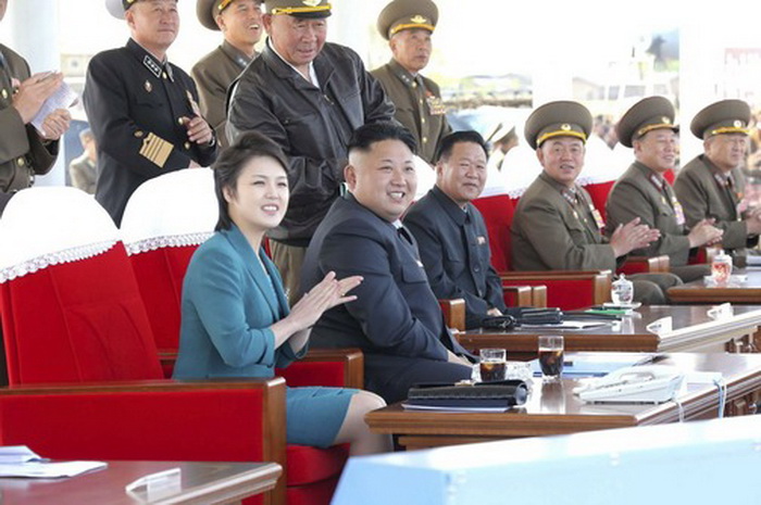 North Korean leader Kim Jong Un and his wife Ri Sol Ju attend the 2014 Combat Flight Contest among commanding officers of the Korean People's Air Force