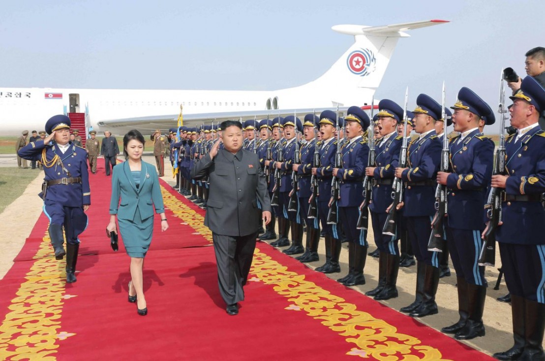 North Korean leader Kim salutes upon arriving for the 2014 Combat Flight Contest among commanding officers of the Korean People's Air Force