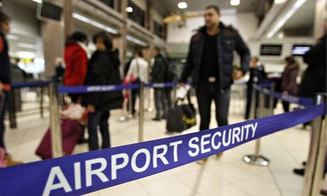 Romanians pass through airport security for a flight to Heathrow airport in Britain